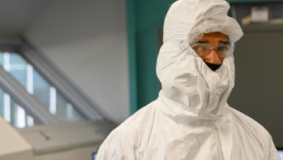 A semiconductor student wearing a clean room bunny suit