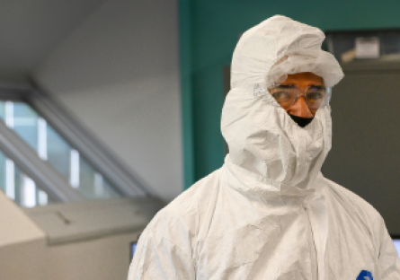 A semiconductor student wearing a clean room bunny suit